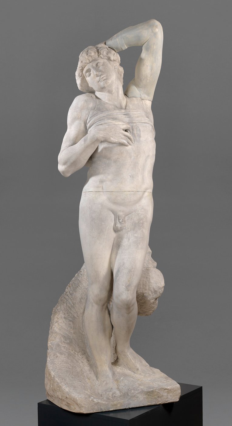 4 The black-and-white photograph shows a centrally placed cast of the upright nude figure of the so-called Dying Slave, created for the tomb of Pope Julius II.